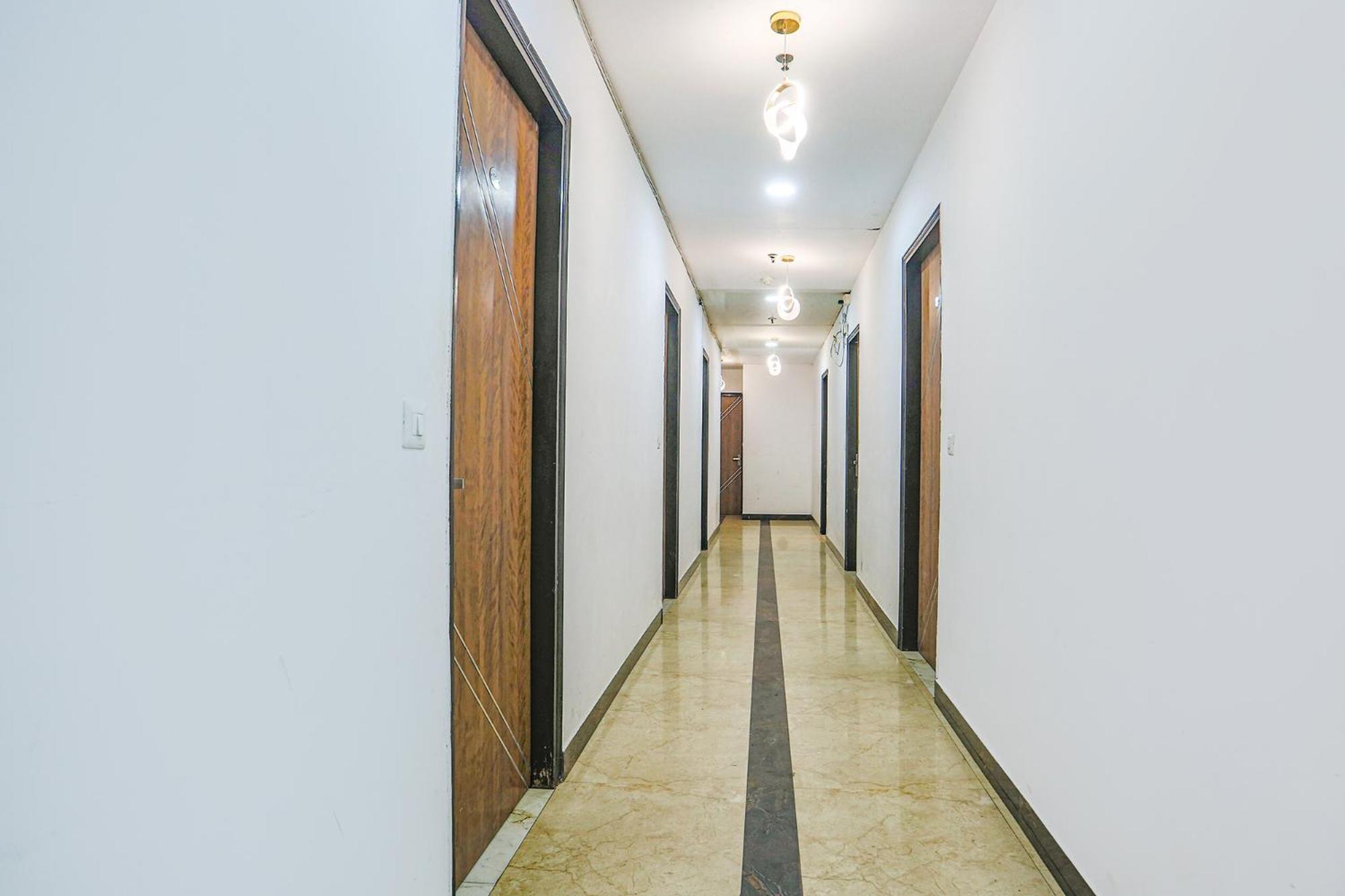 Hotel Collection O Golden Key Near Tdi Mall
